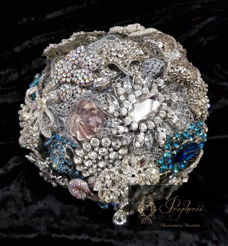 Round blue and silver brooch bouquet