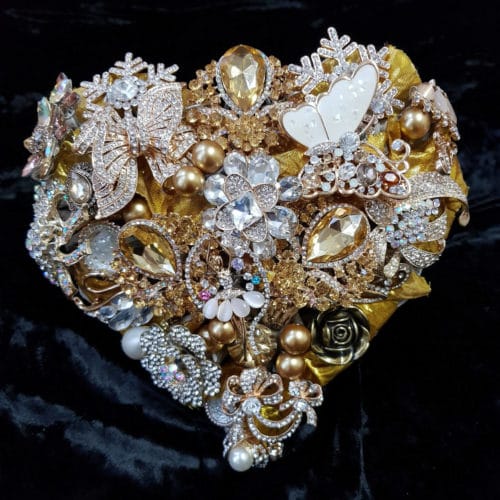 gold and cream heart shaped brooch bouquet